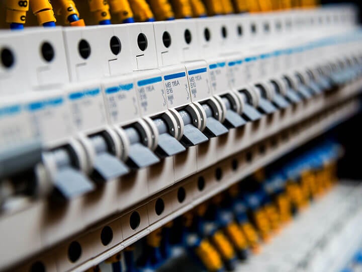 Close up view of voltage switchboard with circuit breakers